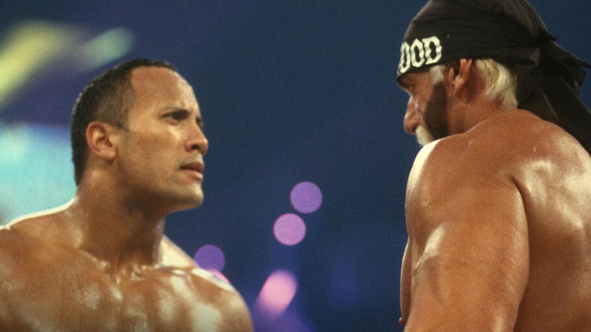 The Rock facing off with Hulk Hogan at WWE WrestleManai X8