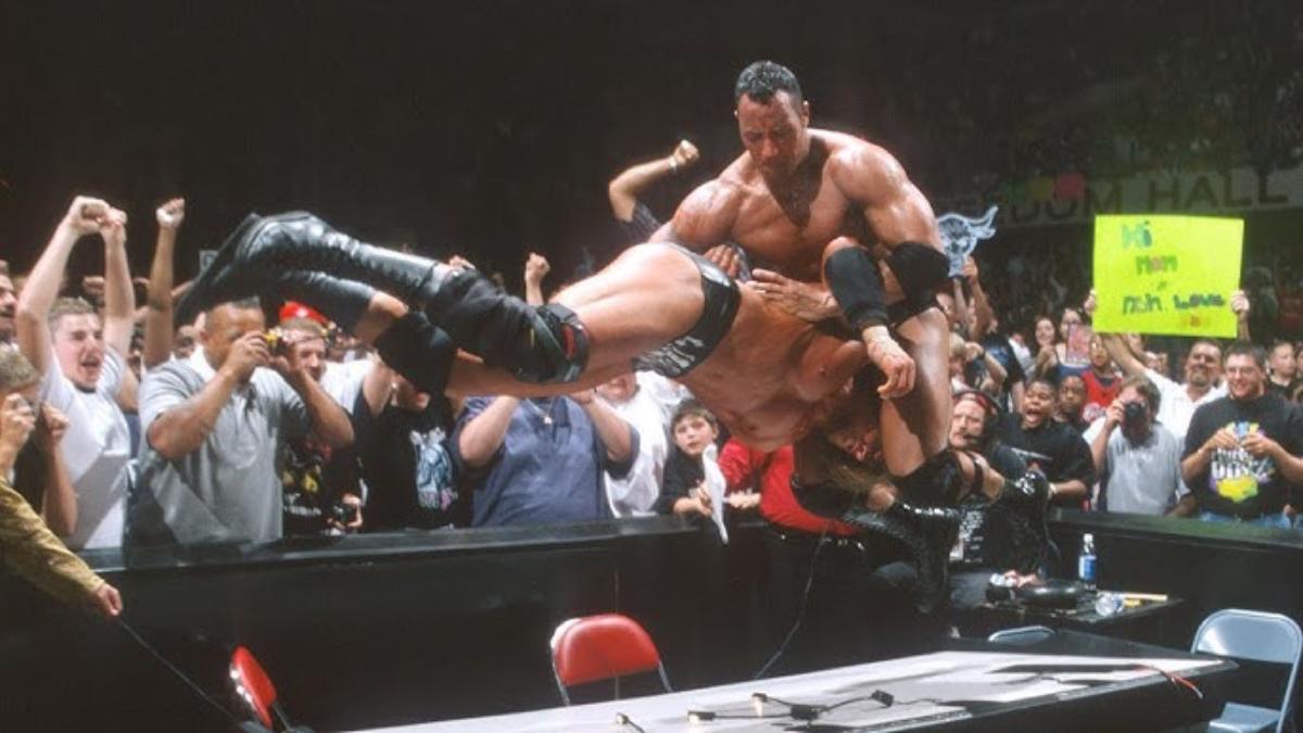 The Rock hitting a Pedigree on Triple H