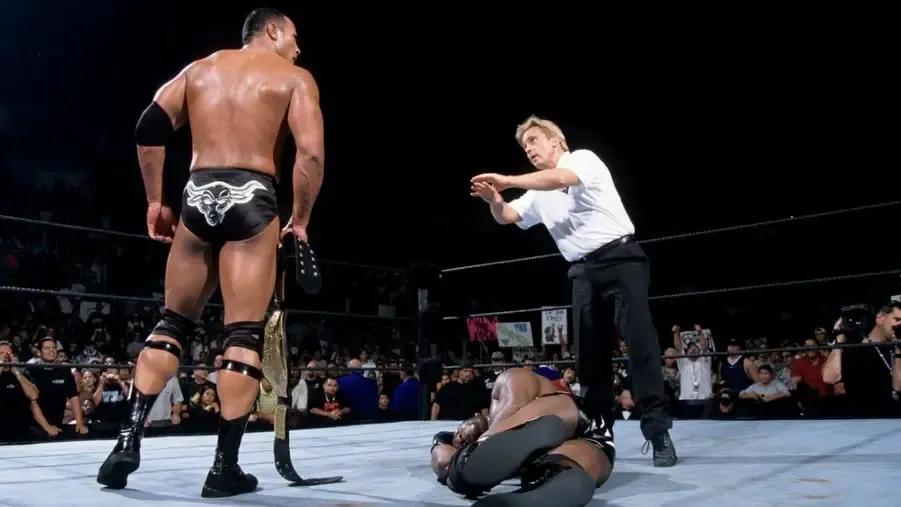 The Rock- Booker T down- WWE SummerSlam 2001.jpg