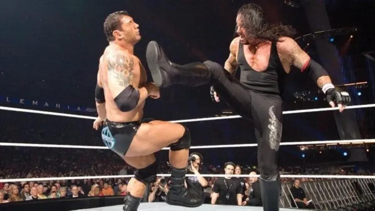 The Undertaker hitting Batista with a Big Boot at WWE WrestleMania 23