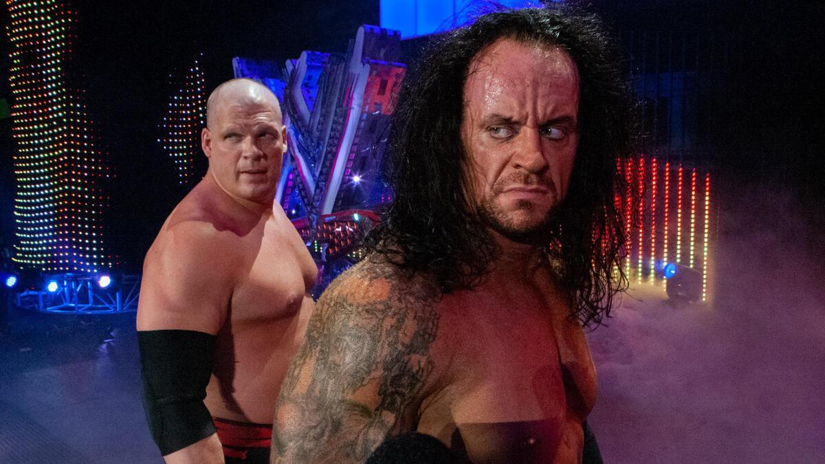 The Undertaker and Kane look back at the ring following a match in 2008