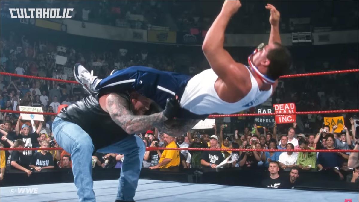 The Undertaker hitting Kurt Angle with a Last Ride in WWE