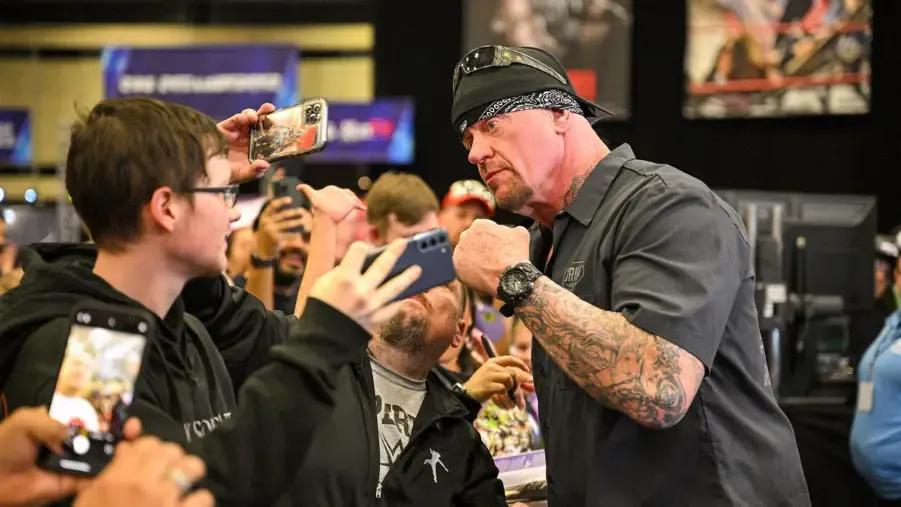 The Undertaker With Fans.jpg