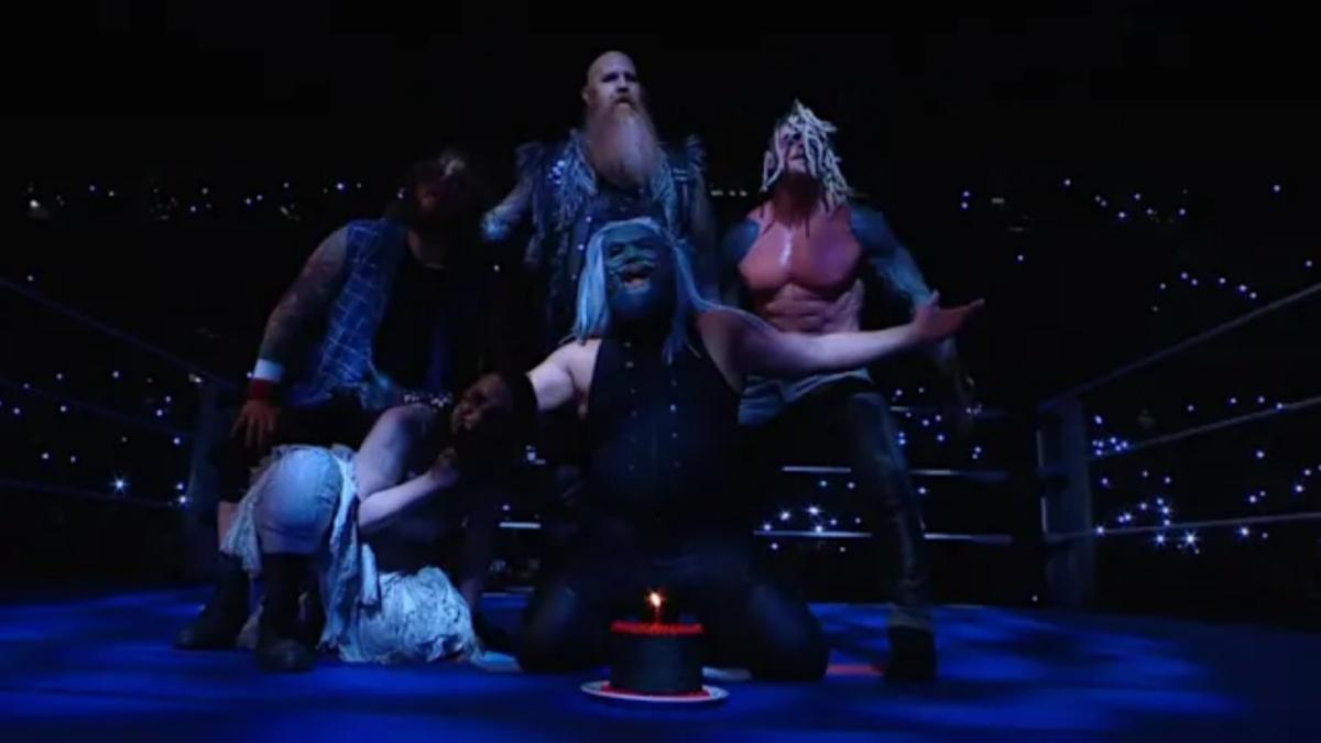 The Wyatt Sicks in the ring with a birthday cake