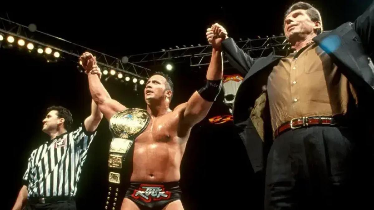 The Rock with Vince McMahon and Shane McMahon at WWE Survivor Series 1998