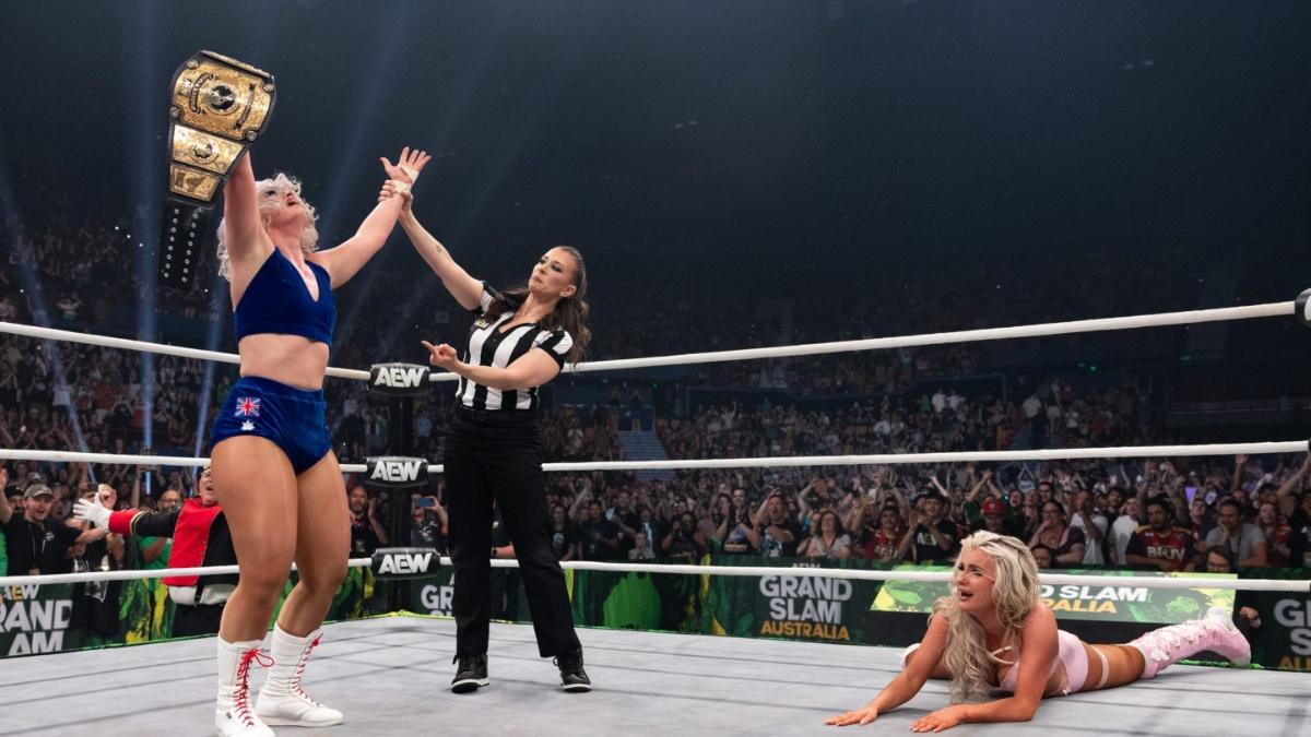 Toni Storm celebrating as Mariah May cries on the mat 