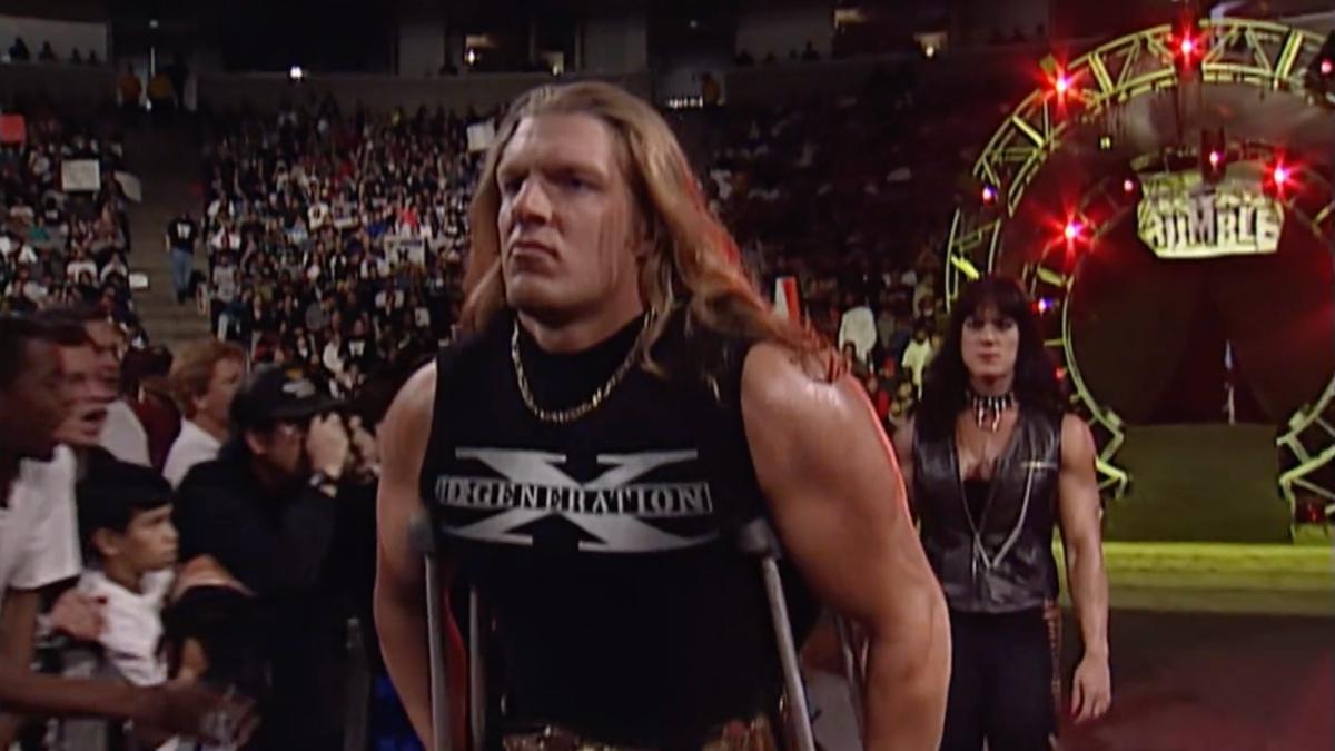 Triple H walking on crutches wearing a DX vest at Royal Rumble 1998