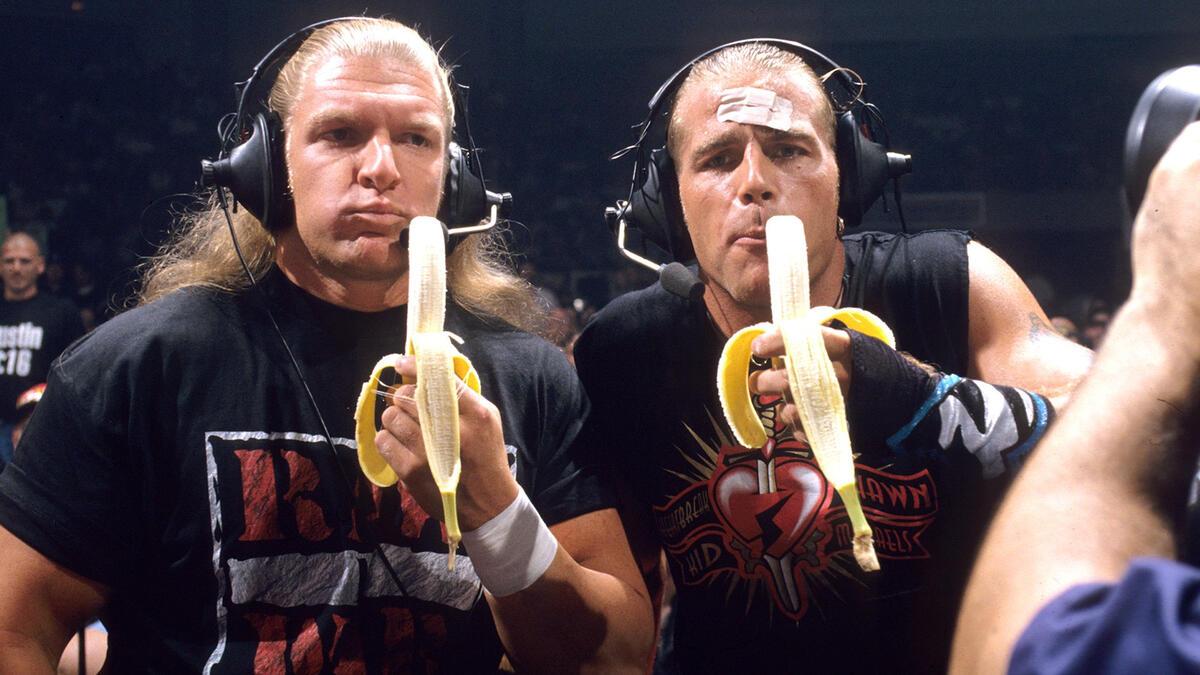 Triple H and Shawn Michaels eat bananas while providing commentary for an episode of WWE Raw in 1997