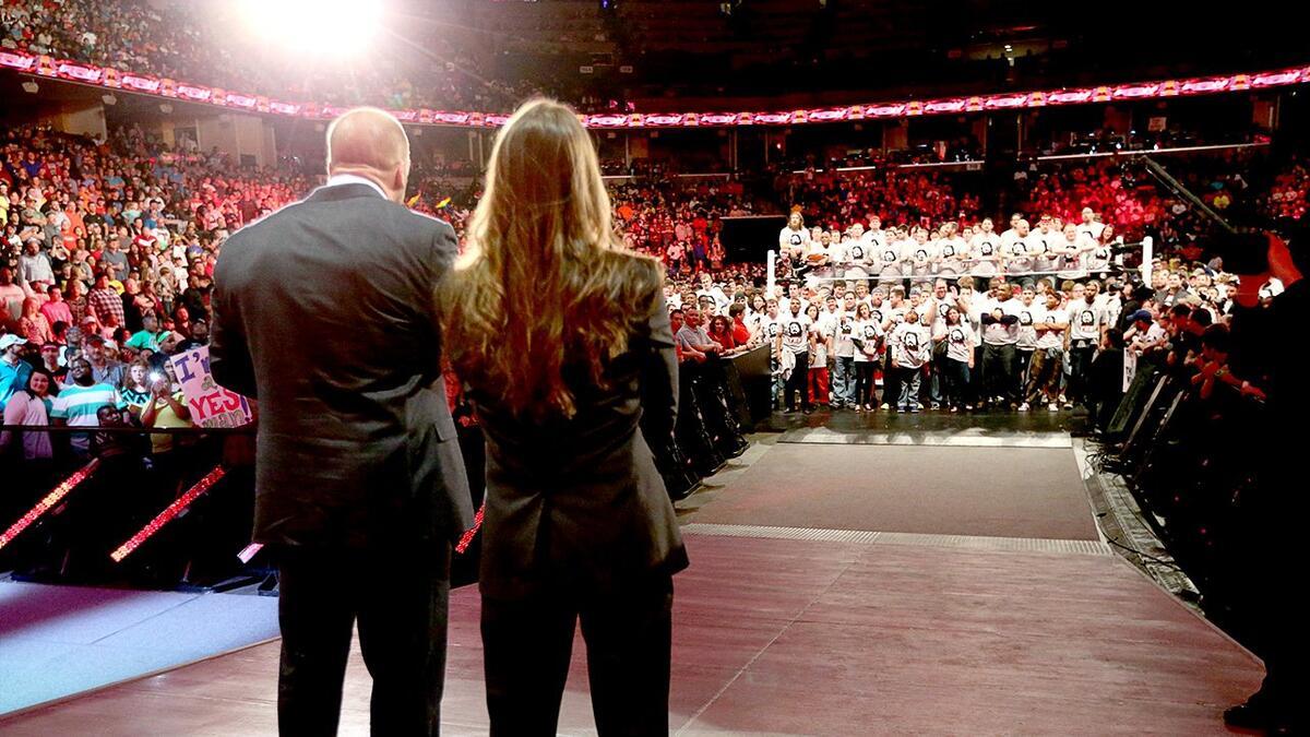 Triple H and Stephanie McMahon looking on at Daniel Bryan and the YES! Movement on a March 2014 episode of WWE Raw