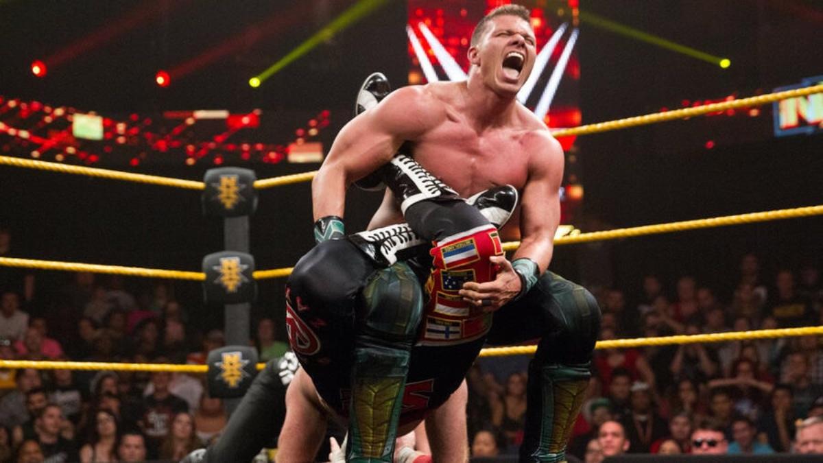 Tyson Kidd holding the Sharpshooter on Sami Zayn during a 2014 episode of WWE NXT