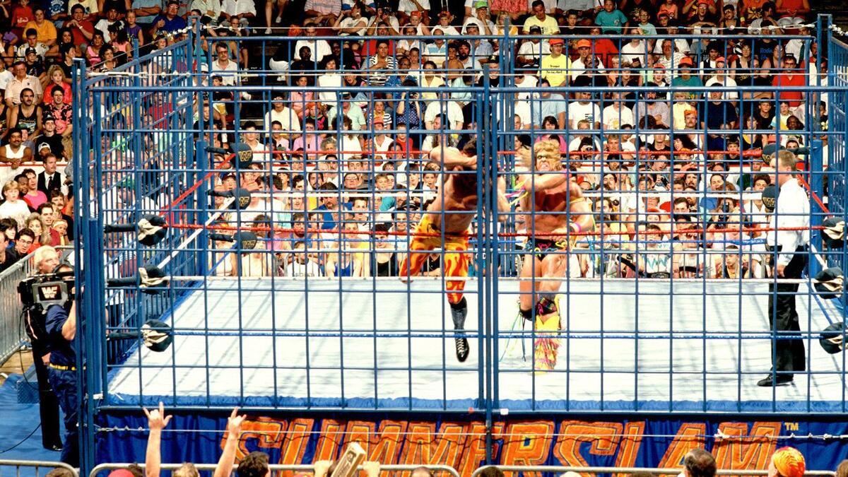 The Ultimate Warrior throws Rick Rude into the cage at WWE SummerSlam 1990