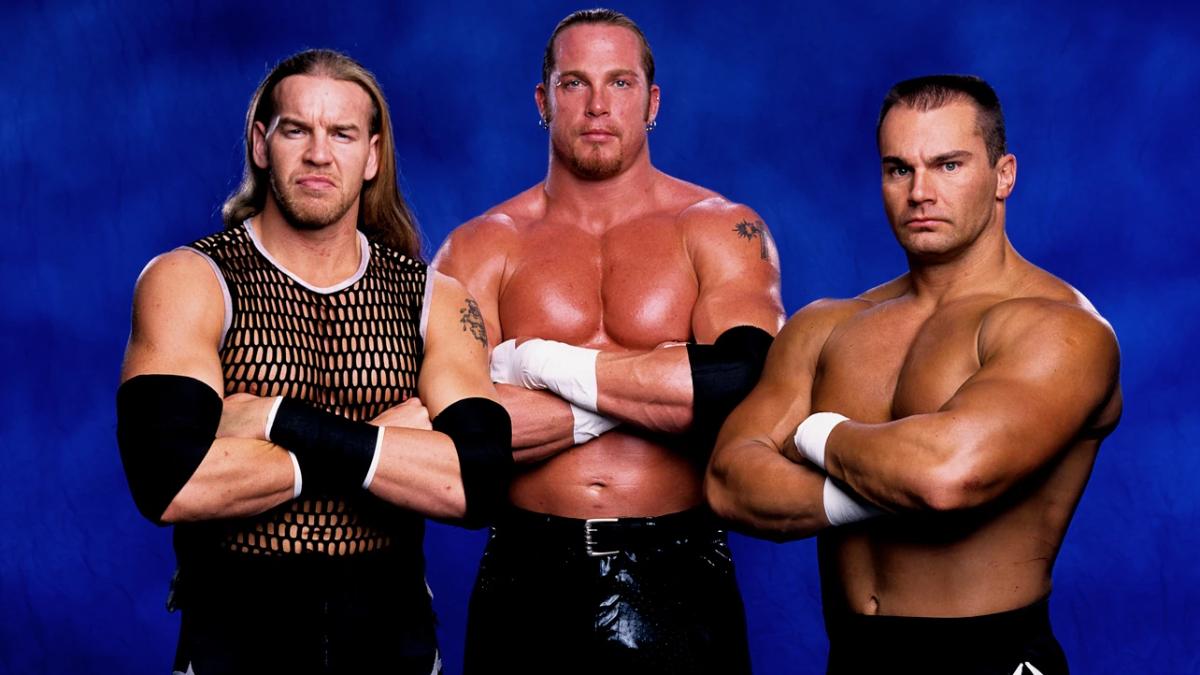 Christian, Test, and Lance Storm with their arms folded
