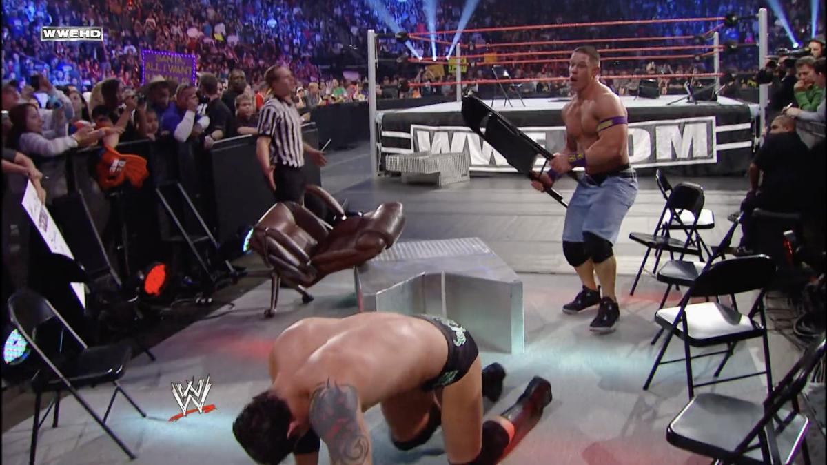 Wade Barrett crawling away from John Cena at TLC 2010