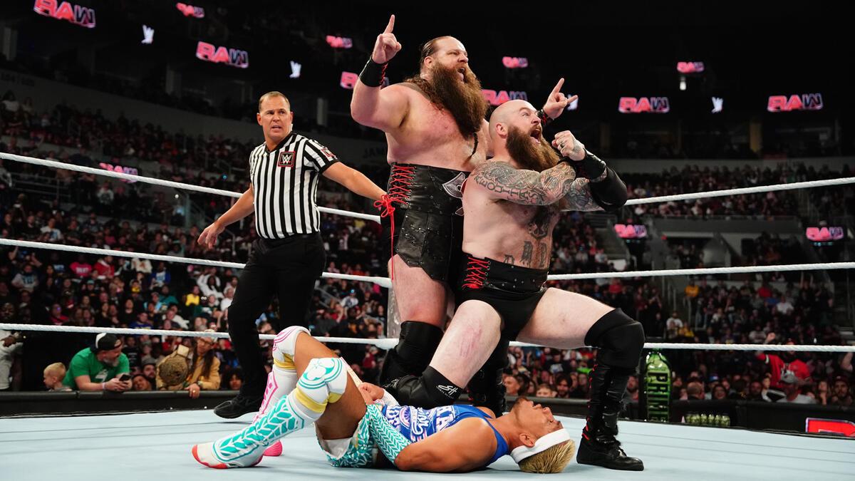 War Raiders (Ivar and Erik) celebrating in the ring following a win, with Erik kneeling on Akira Tozawa