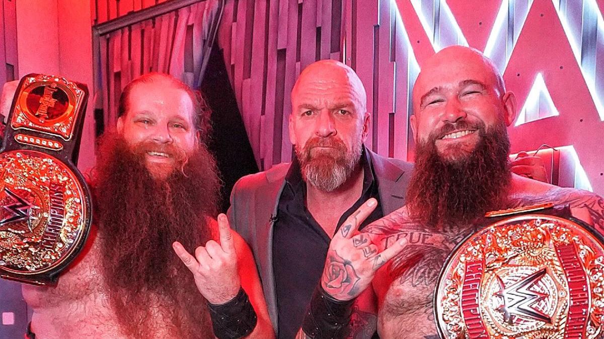 War Raiders celebrating their World Tag Team Title win with Triple H 