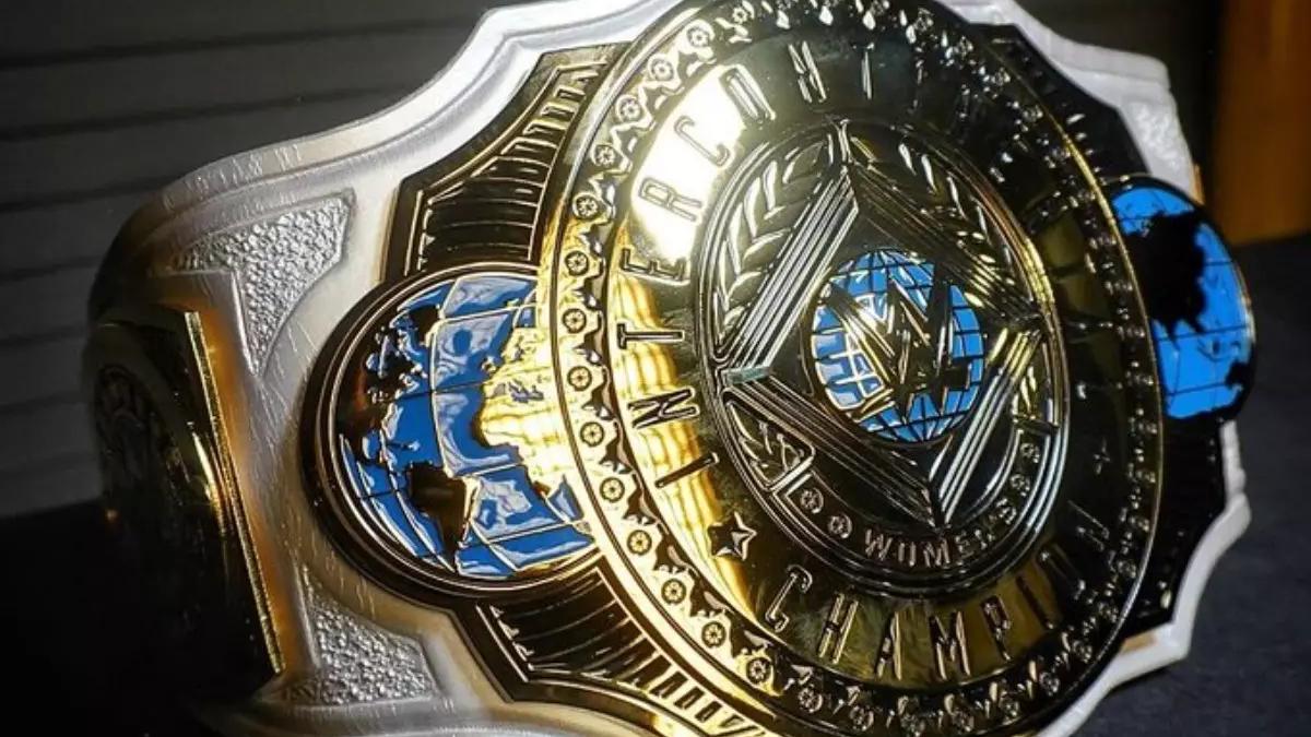 WWE Women's Intercontinental Championship. A gold central plate with blue accents on a white strap.