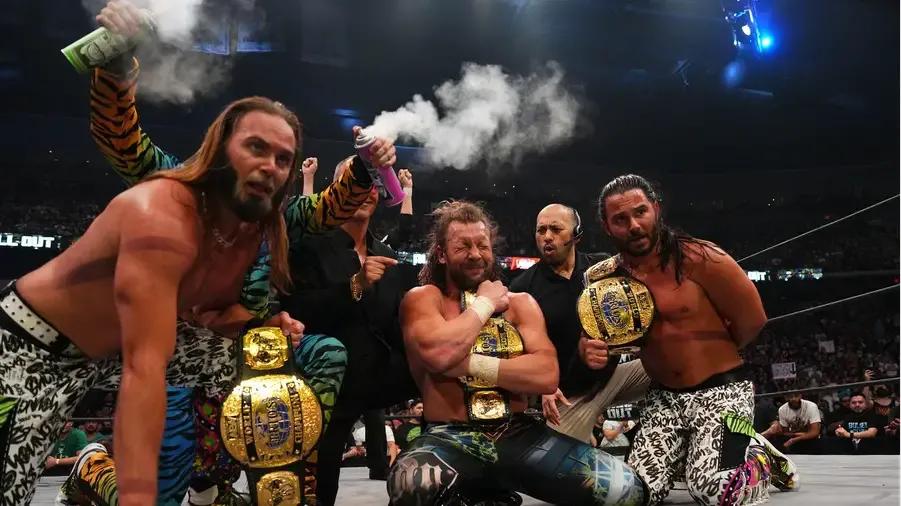 Young Bucks Kenny Omega trios title win smoke.jpg