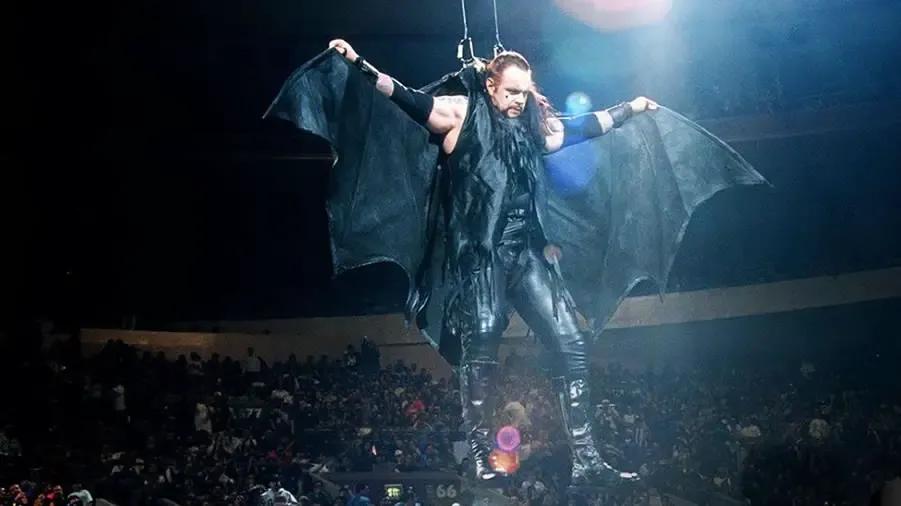 https://cultaholic.com/files/images/e643a1577199ef53a0fa5eb46221450424628fe6-the-undertaker-survivor-series-1996.jpg