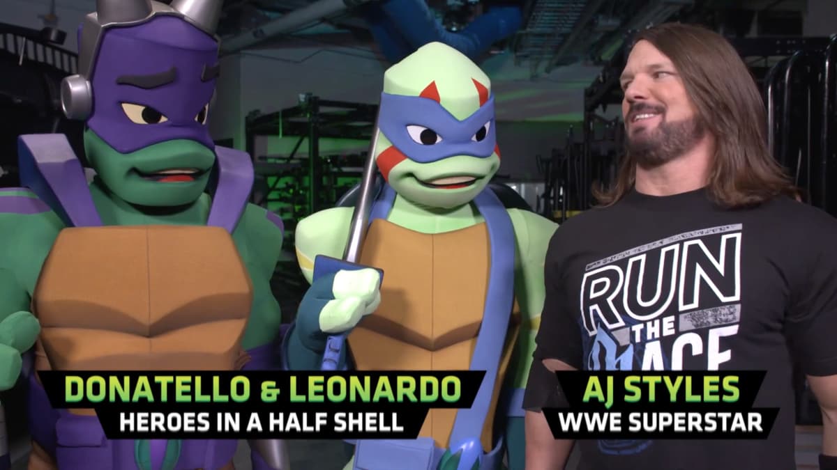AJ Styles with Donatello and Leonardo of the Teenage Mutant Ninja Turtles