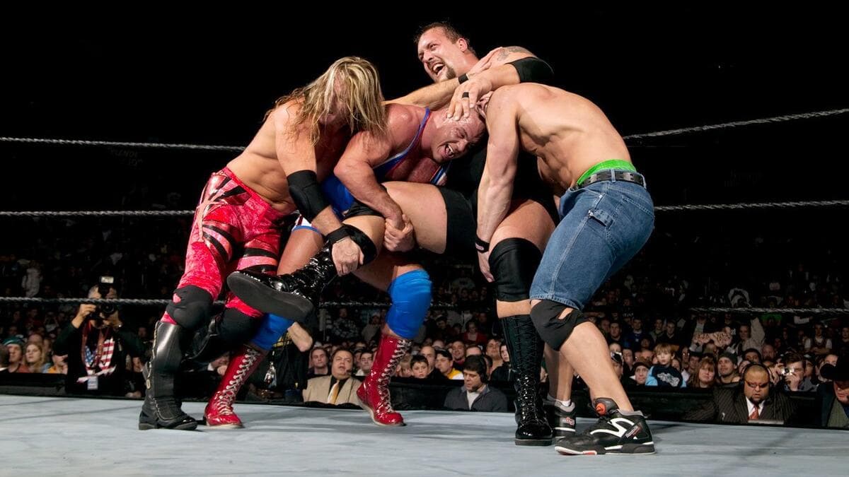 Chris Jericho, Kurt Angle, and John Cena trying to eliminate The Big Show at WWE Royal Rumble 2004