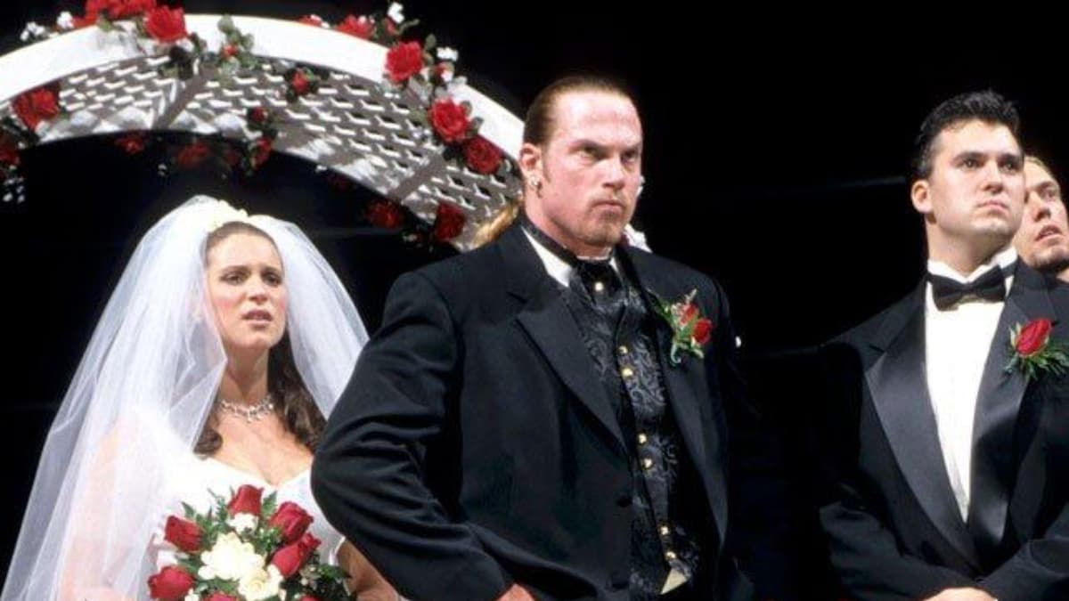 Stephanie McMahon and Test looking sad at their storyline wedding