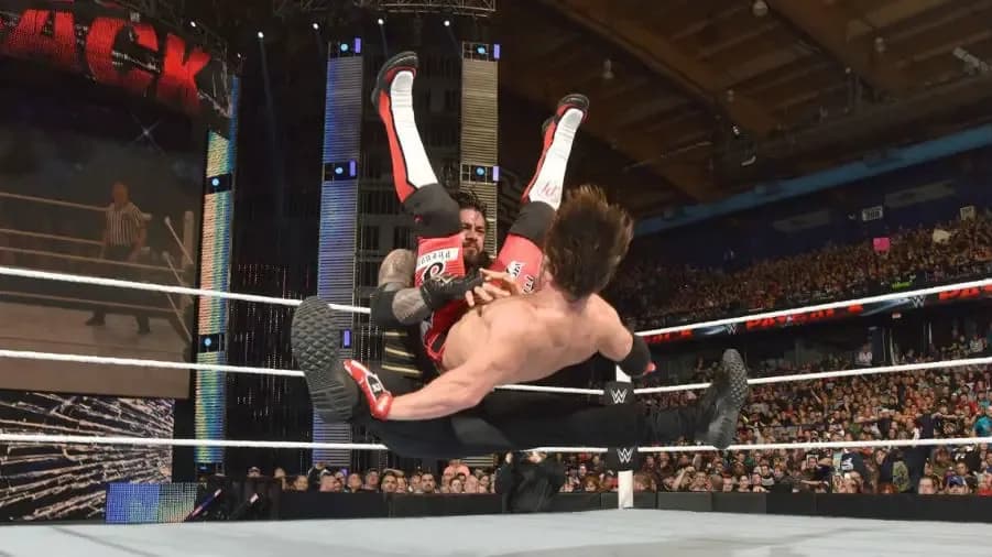https://cultaholic.com/files/images/05dc9caea817c57f3e71a0a0cf08e29a383f6ef1-roman-reigns-AJ-STYLES-.jpg