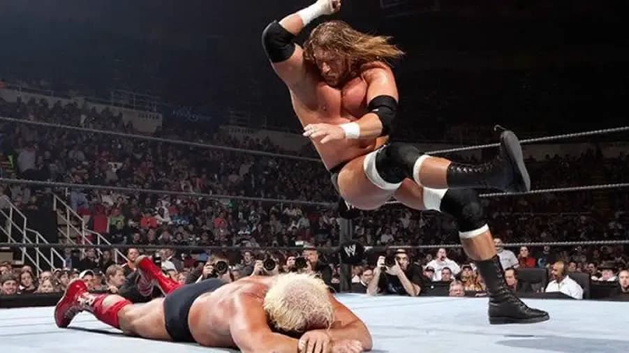 https://cultaholic.com/files/images/409193d8ebcc5f64fdb306f0c6ca05486cc760ed-triple-h-ric-flair-survivor-series-2005.jpg