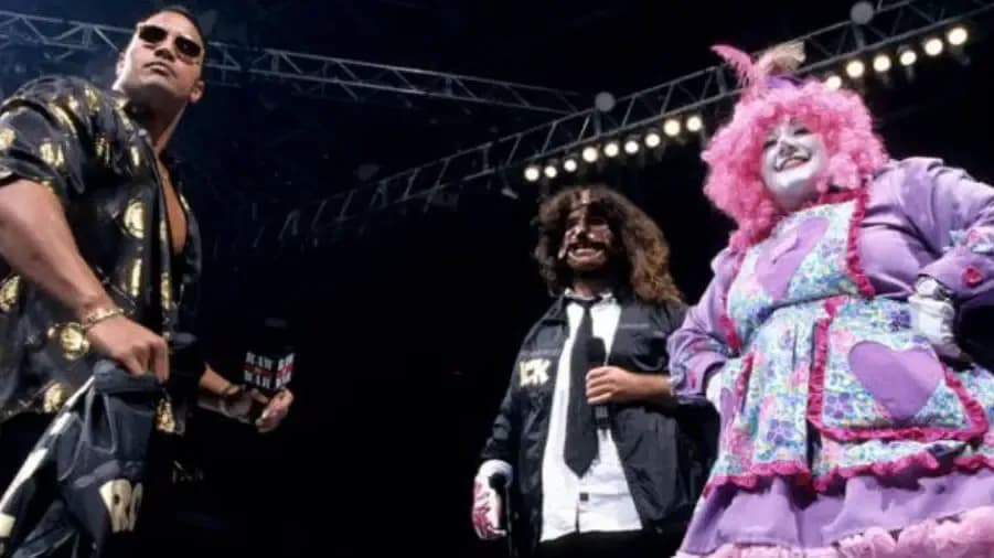 https://cultaholic.com/files/images/622e4a388678edbede4a7455158dd1213efe2422-the-rock-mankind-rock-n-sock-connection.jpg