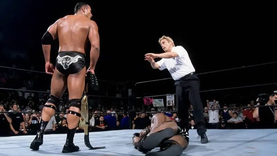https://cultaholic.com/files/images/7553abb63f487b21d4aea3b1eba402cb1a57da5f-THE-ROCK-BOOKER-T-SUMMERSLAM-2001.jpg