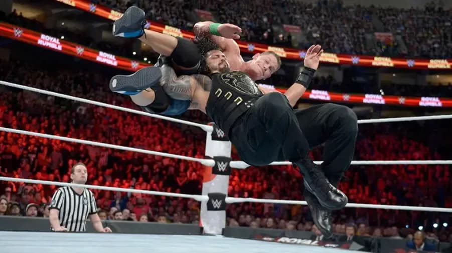 https://cultaholic.com/files/images/8e6cdb2d17de6effc792408d2574f7c0460fb9a1-cena-reigns-royal-rumble-2018.jpg