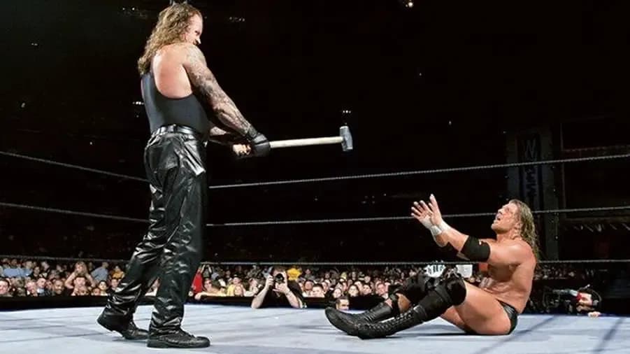 https://cultaholic.com/files/images/9807b3ee2e3b87c96e58ace463ee9e41b78e482a-the-undertaker-triple-h-wrestlemania-17.jpg