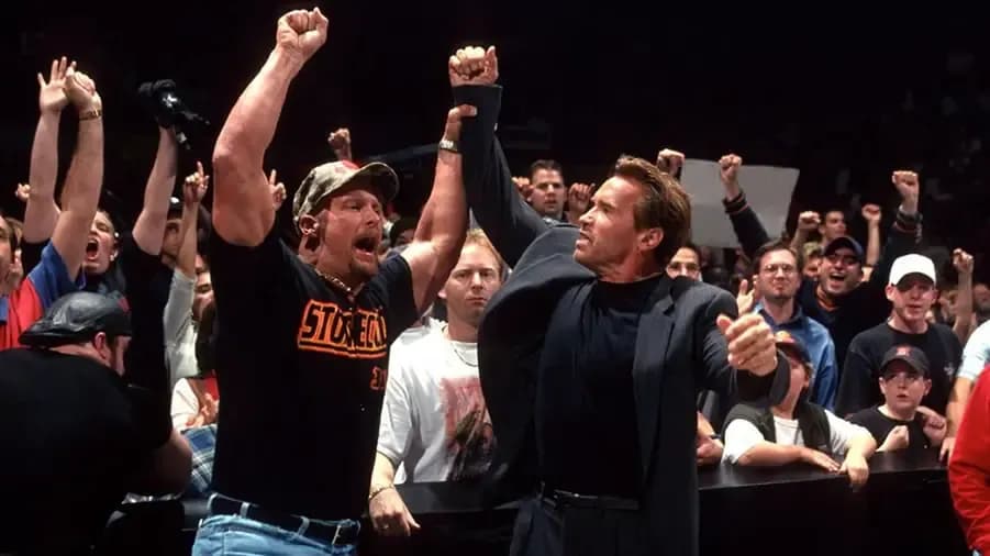 https://cultaholic.com/files/images/b0c2b0bcfc2d2d75be7670d7b9b23e3db9cd63d5-stone-cold-steve-austin-arnold-.jpg
