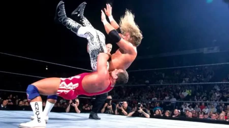 https://cultaholic.com/files/images/e8d79164fd23671606f970d6610425a536a214ae-BACKLASH-2002-KURT-ANGLE-EDGE.jpg