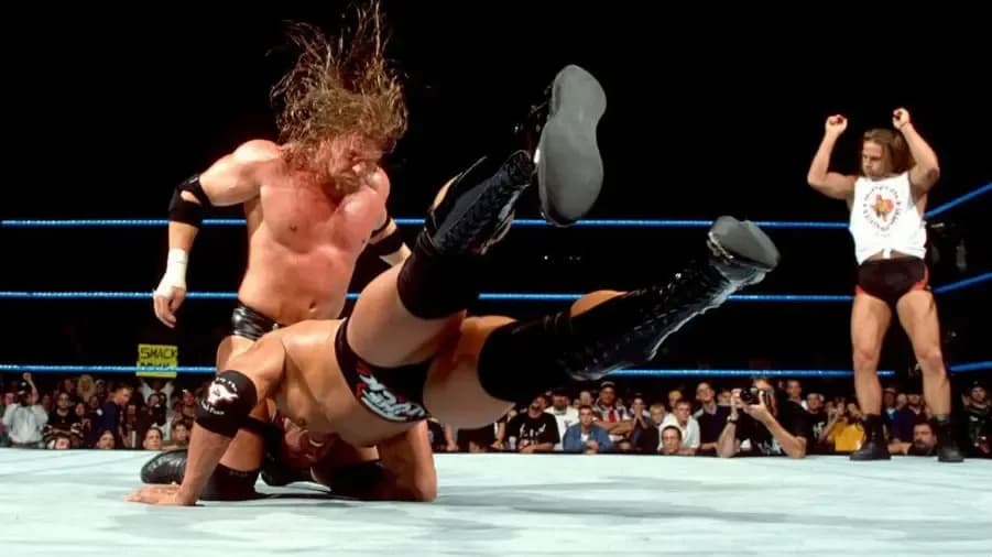 https://cultaholic.com/files/images/f6ad877268b12597ef89c1878daf1d4dbe972468-triple-h-the-rock-shawn-michaels-smackdown.jpg