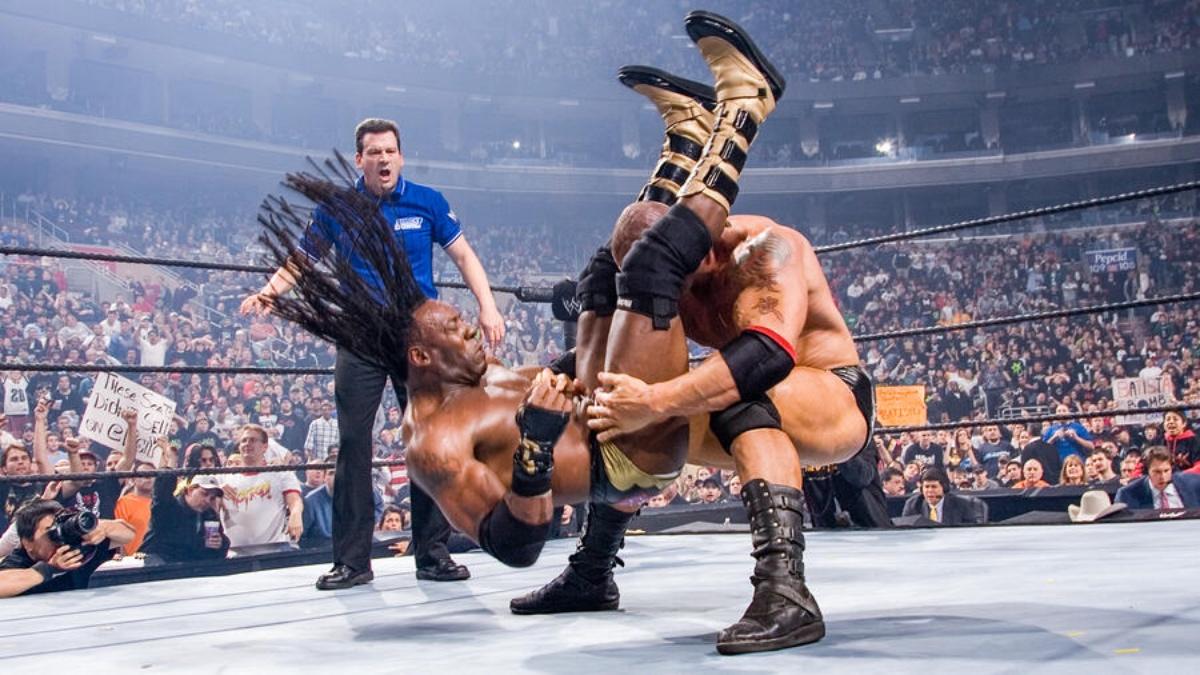 Batista hitting a Batista Bomb to Booker T at WWE Survivor Series 2006