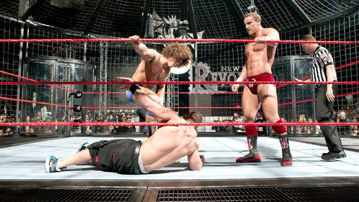 Christ Masters and Carlito beating down John Cena at WWE New Year's Revolution 2006