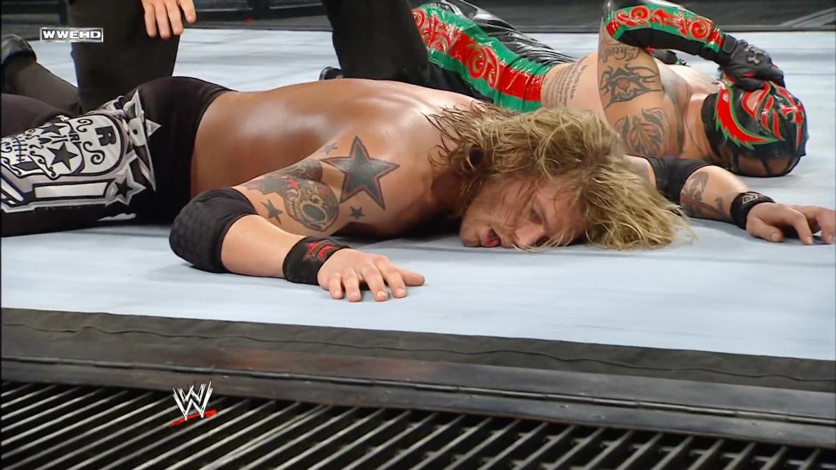 Edge and Rey Mysterio lying down in the ring exhausted at WWE Elimination Chamber 2011