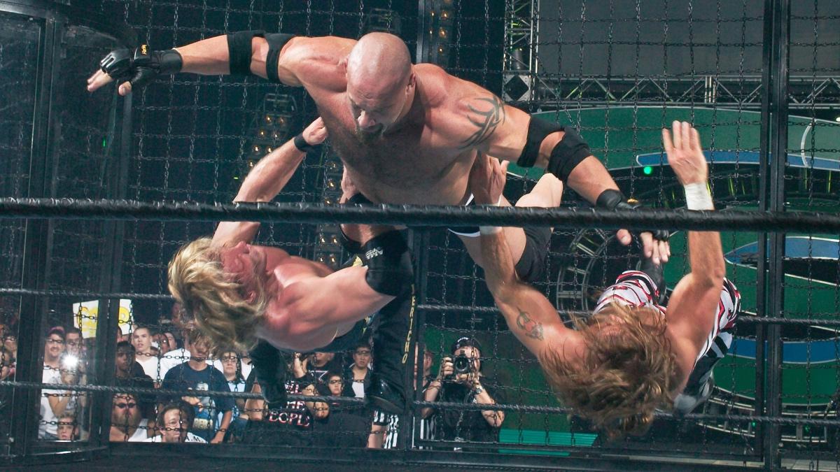Goldberg with a jumping clothesline to Chris Jericho and Shawn Michaels at WWE SummerSlam 2003