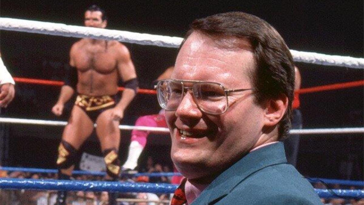 Jim Cornette in the 1990s standing outside of the ring smiling