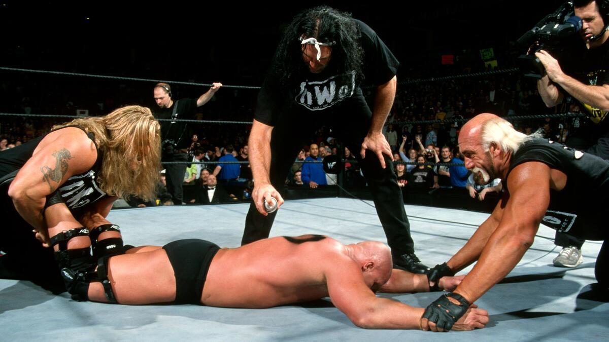 NWO beating down Steve Austin at No Way Out 2002
