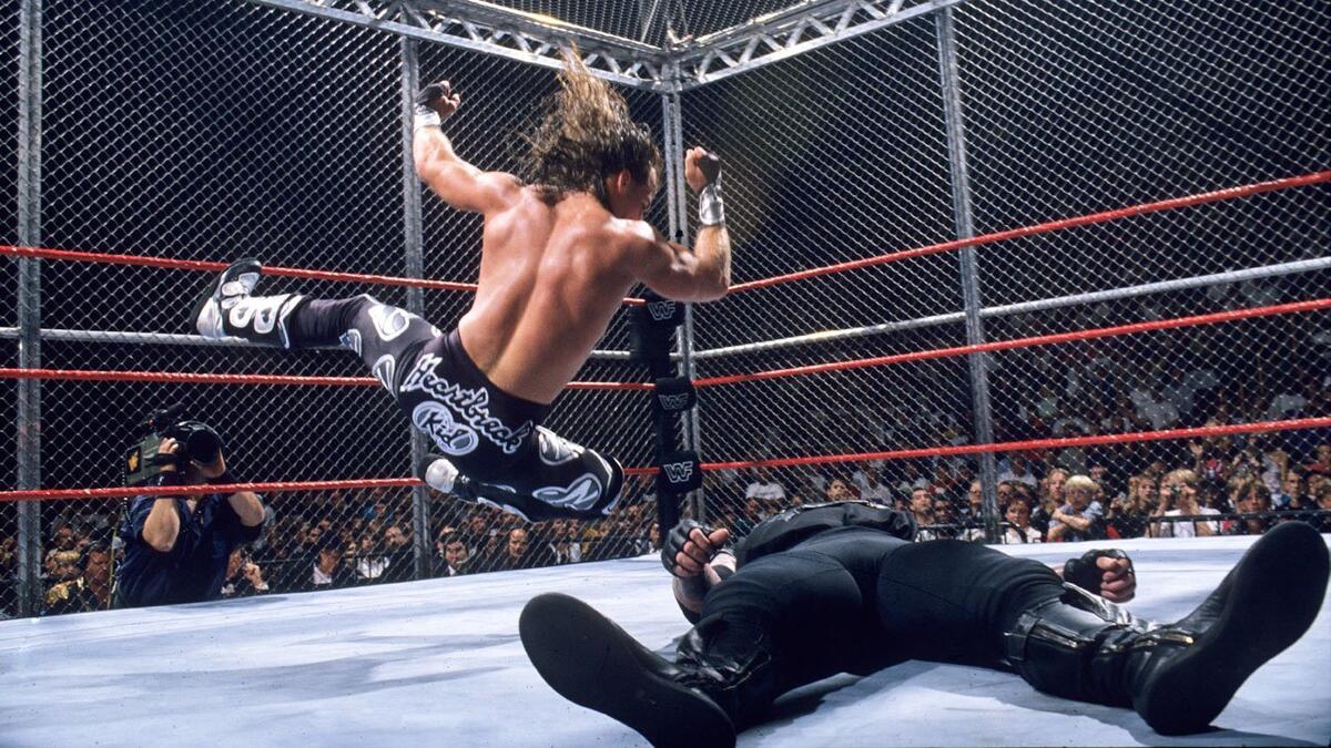 Shawn Michaels hitting an elbow drop at Badd Blood 1997