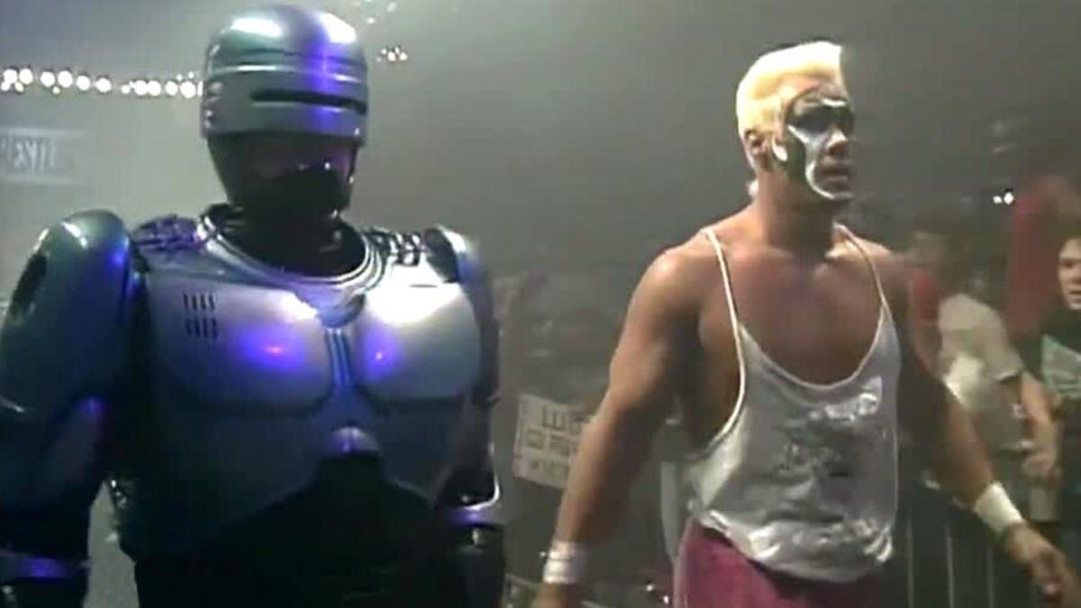 Sting standing alongside Robocop at Capital Combat 1990