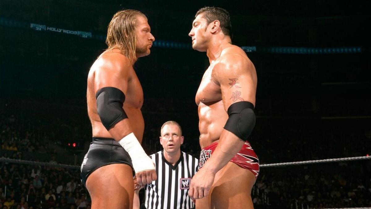Triple H and Batista face to face in the centre of the ring at WWE WrestleMania 21