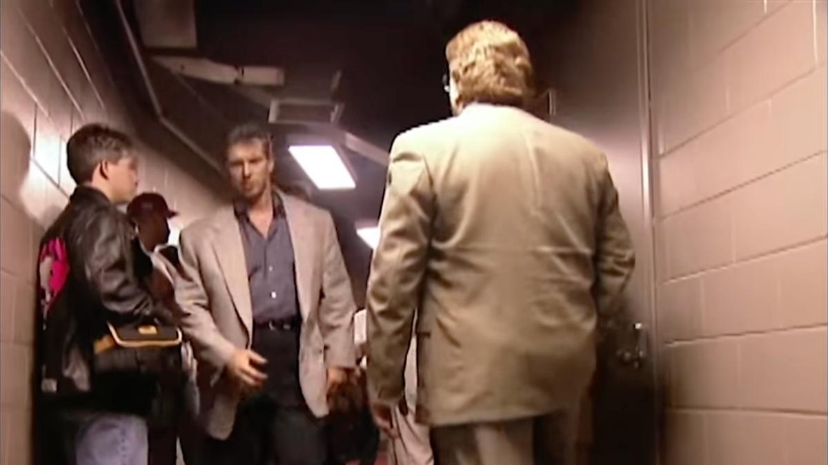 Vince McMahon woozily walking through the corridor