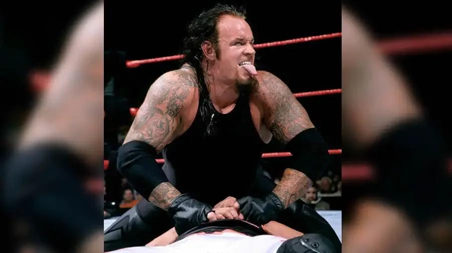 https://cultaholic.com/files/images/af210a96b57fa7b725c7db0eafd3ed1c672f2a40-THE-UNDERTAKER-SUMMERSLAM-1999.jpg