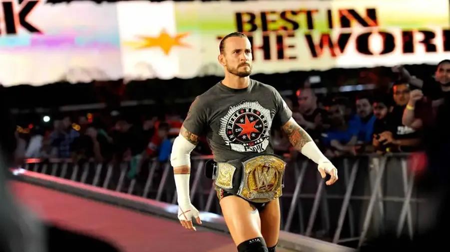 https://cultaholic.com/files/images/b648fc6d77de16587eac464515b332fd0286d8a7-cm-punk-wwe-champion.jpg