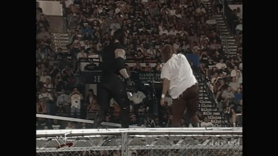 https://cultaholic.com/files/images/bcdd947a121377708b8bd000c5c6b4ef8ff1352c-undertaker-mankind-first-fall-hell-in-a-cell.gif
